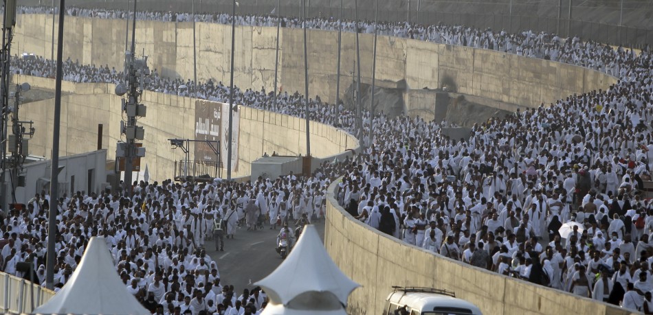 Muslim pilgrims arrive to cast stones at pillars symbolising Satan, as part of a Hajj pilgrimage rite