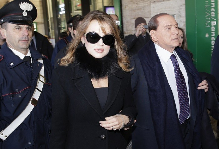 Former Italian Prime Minister Silvio Berlusconi (R) and his fiancée Francesca Pascale.