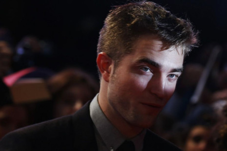 Robert Pattinson and Dylan Penn Taking Things Slow/Reuters