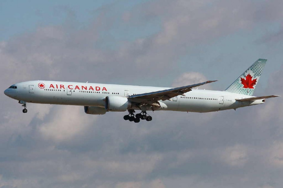 Air Canada plane makes emergency landing after passenger tries to open ...