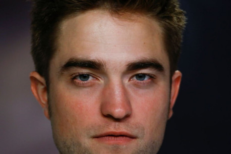 Twilight heartthrob Robert Pattinson is reportedly taking tips from rumoured new girlfriend, Dylan Penn on how to deal with paparazzi. (Reuters)