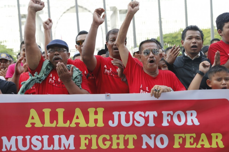 Muslim demonstrators chant slogans outside Malaysia's Court of Appeal in Putrajaya, outside Kuala Lumpur