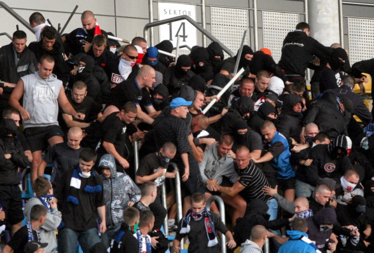Football fans in Poland clash with police at a match Widzew Lódz and Zawisza Bydgoszcz PIC: Reuters