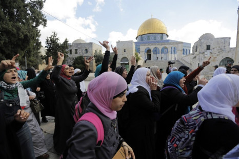 Palestinian women protest following minor clashes at the compound known to Muslims as Noble Sanctuary and to Jews as Temple Mount in Jerusalem's Old City