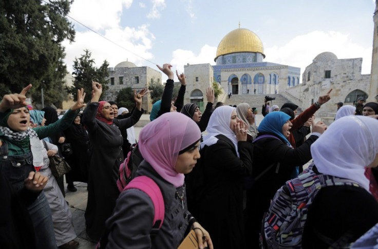 Palestinian women protest following minor clashes at the compound known to Muslims as Noble Sanctuary and to Jews as Temple Mount in Jerusalem's Old City
