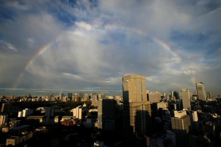 A rainbow is seen over high rise buildings in Tokyo
