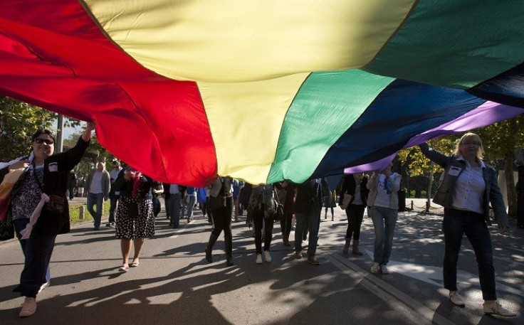Gay-rights supporters carry a rainbow flag as they walk during a Pride March in Montenegro.