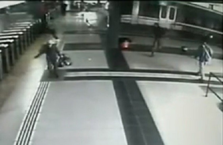 Bystanders flee as train mounts platform at Once station in Buenos Aries PIC: Youtube