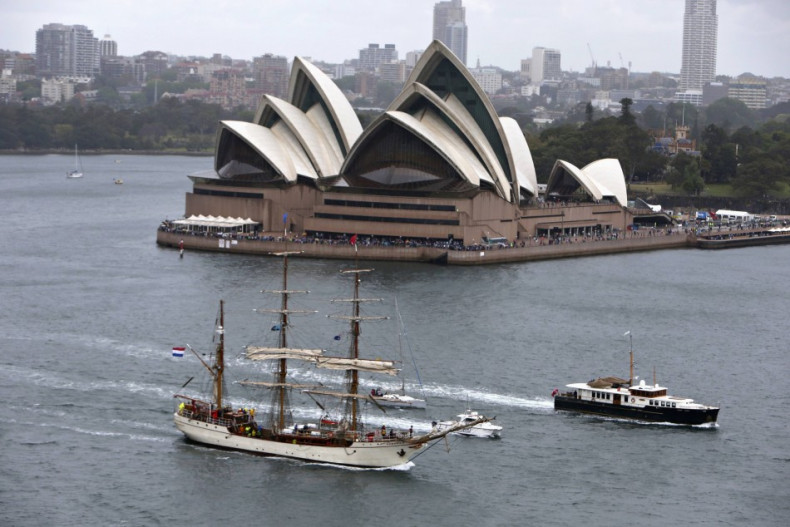 A tall ship sails past the Sydney Opera House as it enters Sydney Harbour as part of the International Fleet Review celebrations