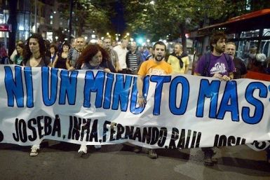 Supporters of ETA prisoners carry a protest banner during October 2013