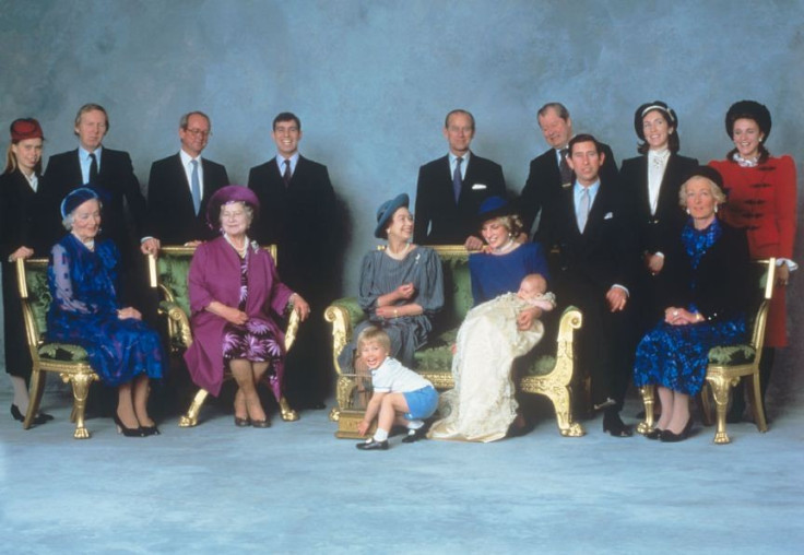 Prince William plays as Princess Diana holds little prince Harry on his christening day. (Photo: Clarence House)