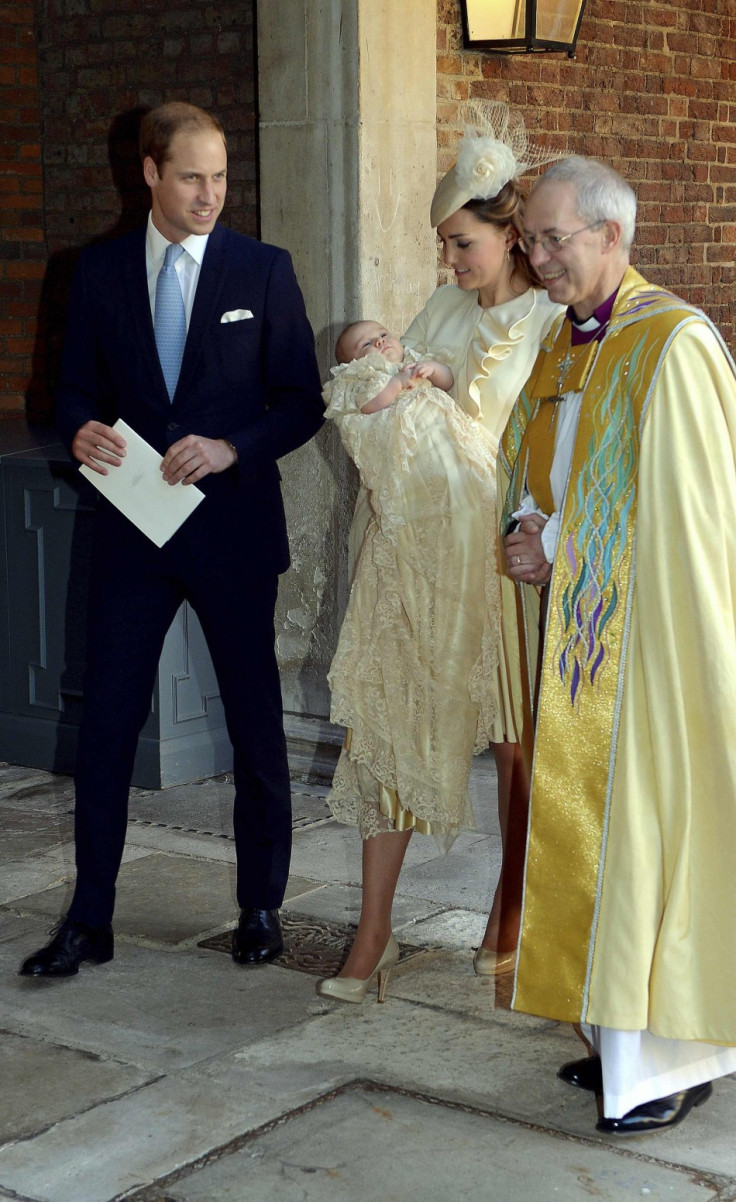 Britain's Catherine, Duchess of Cambridge walks with her husband Prince William and Justin Welby as she carries her son Prince George after his christening at St James's Palace in London