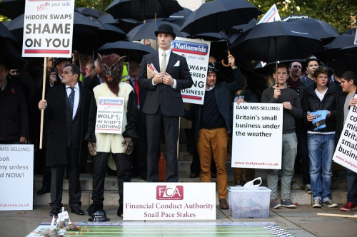 Bully-Banks' protest outside Houses of Parliament over the mis-selling of derivatives by HSBC, Barclays, RBS and Lloyds (Photo: IBTimes UK) Bully-Banks' protest outside Houses of Parliament over the mis-selling of derivatives by HSBC, Barclays, RBS and Lloyds (Photo: IBTimes UK)