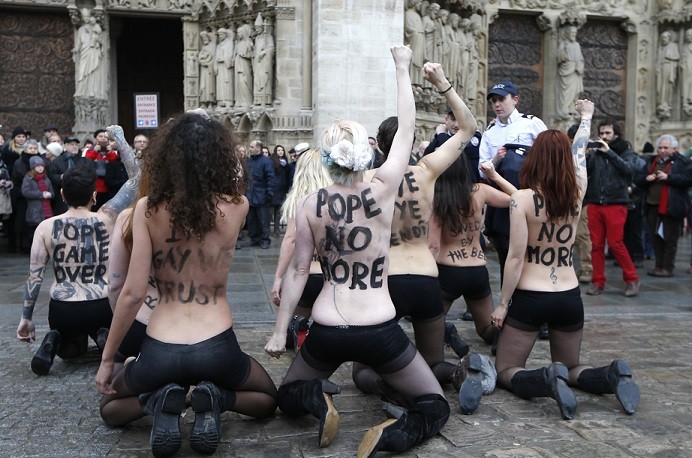 The group protests outside Notre-Dame de Paris Cathedral in Paris to celebrate French parliament’s approve a draft law allowing same-sex marriage (Reuters) The group protests outside Notre-Dame de Paris Cathedral in Paris to celebrate French parliament’s approve a draft law allowing same-sex marriage (Reuters)