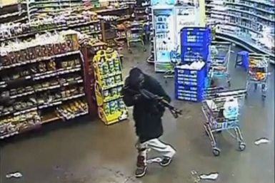 A gunman aims his rifle inside a store during an attack on the Westgate shopping mall