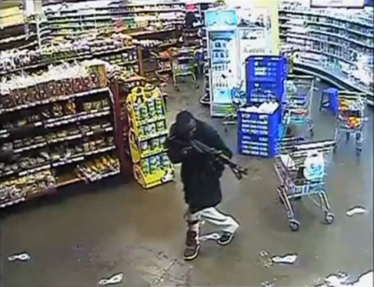 A gunman aims his rifle inside a store during an attack on the Westgate shopping mall