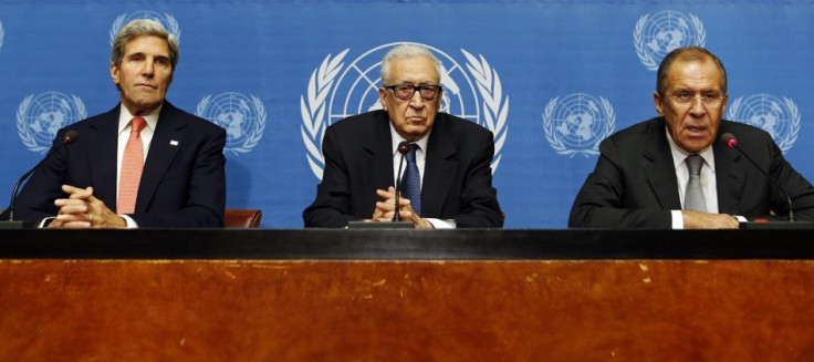 U.S. Secretary of State John Kerry (L) sits with U.N. Special Representative Lakhdar Brahimi (C) and Russian Foreign Minister Sergei Lavrov