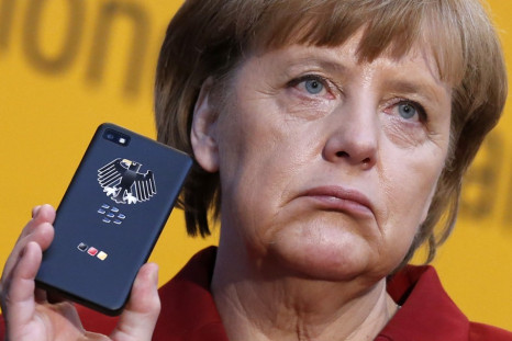 German Chancellor Merkel holding a smartphone