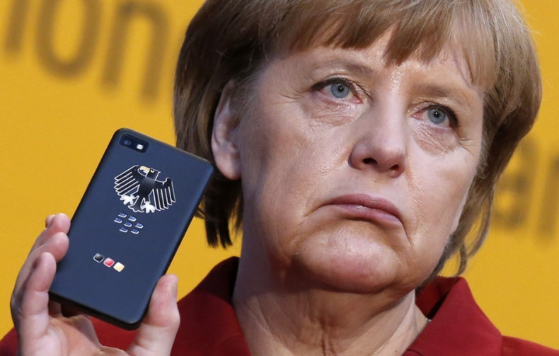 German Chancellor Merkel holding a smartphone