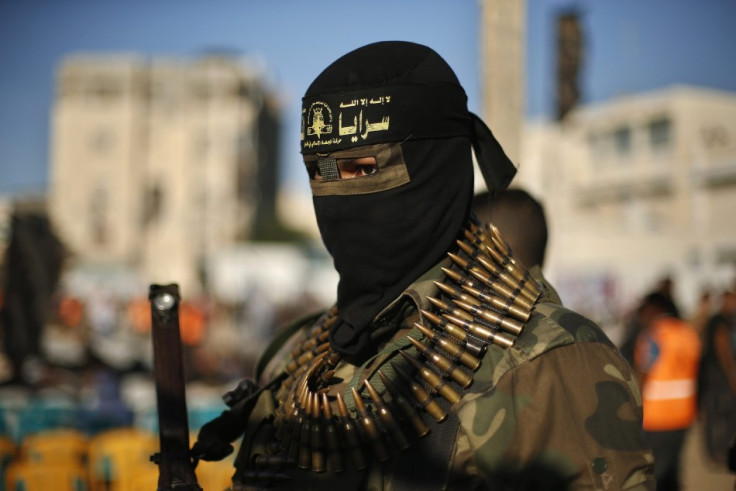A Palestinian militant stands guard during anti-Israeli rally organized by Islamic Jihad movement in Rafah