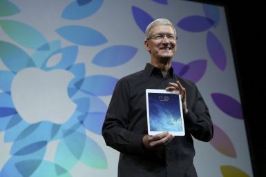 Apple Inc CEO Tim Cook Holds up the New iPad Air During an Apple Event in San Francisco, California