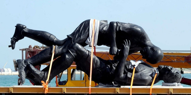 The 'Coup de Tete' being loaded onto a lorry before being taken away (Reuetrs)