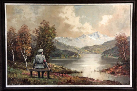 The banality of the banality of evil by Banksy hangs in Housing Works