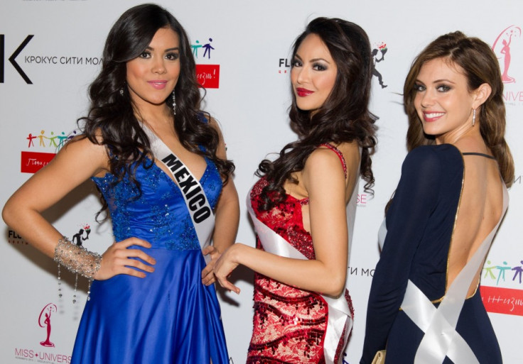 Cynthia Duque, Miss Universe Mexico 2013; Riza Santos, Miss Universe Canada 2013; and Erin Brady, Miss USA 2013; pose for a photo during arrivals for the National Gift Auction at Crocus City Mall on October 30, 2013. (Photo: MIss Universe Organization L.P