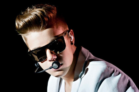 Justin Bieber was pictured leaving a Brazilian brothel covered in a sheet.(Reuters)