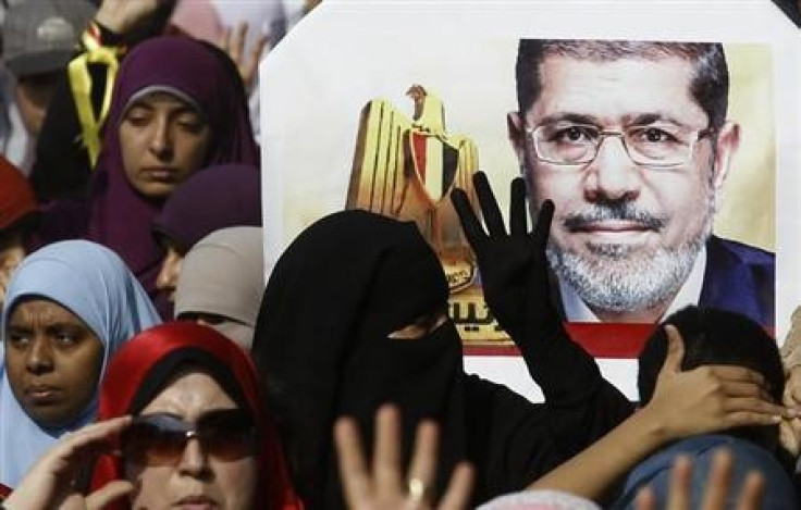 Supporters of the Muslim Brotherhood and ousted Egyptian President Mohamed Mursi take part in a protest against the military and interior ministry in the southern suburb of Maadi, on the outskirts of Cairo November 1, 2013.