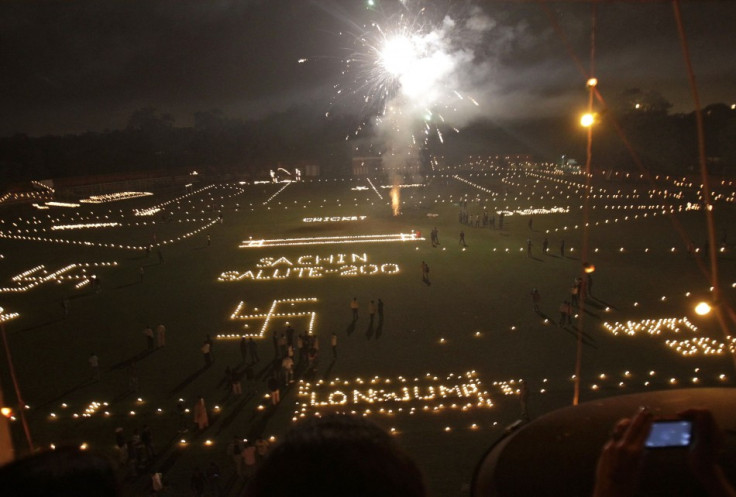 Candles spelling out a message about Indian cricketer Sachin Tendulkar are seen on a cricket pitch on the eve of Diwali in Allahabad. (Photo: Reuters)