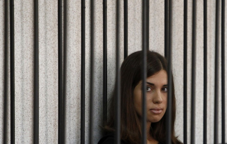 Member of the female punk band "Pussy Riot" Nadezhda Tolokonnikova looks out from a holding cell as she attends a court hearing to appeal for parole at the Supreme Court of Mordovia