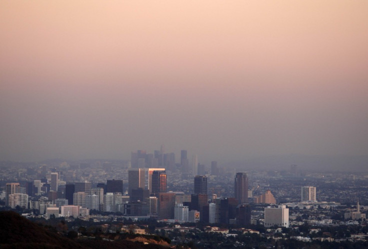 Century City and downtown Los Angeles are seen through the smog in this December 31, 2007 file photo. The air we breathe is laced with cancer-causing substances and should now be classified as carcinogenic to humans, the World Health Organization's cancer