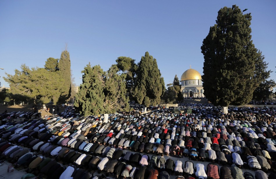 Palestinians pray in front of the Dome of the Rock on the compound known to Muslims as al-Haram al-Sharif and to Jews as Temple Mount in Jerusalem's Old city,
