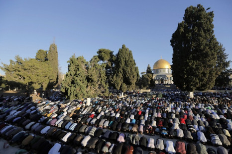 Palestinians pray in front of the Dome of the Rock on the compound known to Muslims as al-Haram al-Sharif and to Jews as Temple Mount in Jerusalem's Old city,