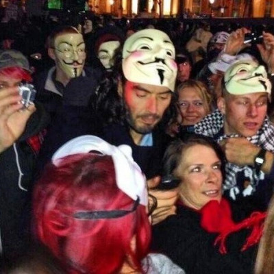 Russell brand with a mask of Guys Fawkes - who tried to destroy parliament PIC: @SpaceMonkey0000