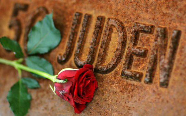 A red rose lies at Gleis 17 (platform 17) holocaust memorial at a former cargo railway station in Berlin-Grunewald, to mark the Kristallnacht, or Night of Broken Glass (Photo: Reuters) A red rose lies at Gleis 17 (platform 17) holocaust memorial at a former cargo railway station in Berlin-Grunewald, to mark the Kristallnacht, or Night of Broken Glass (Photo: Reuters)