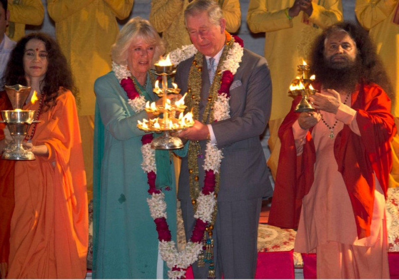 Charles and Camilla perform Aarti along with Indian sages on the banks of Ganges river. (Photo: Reuters)