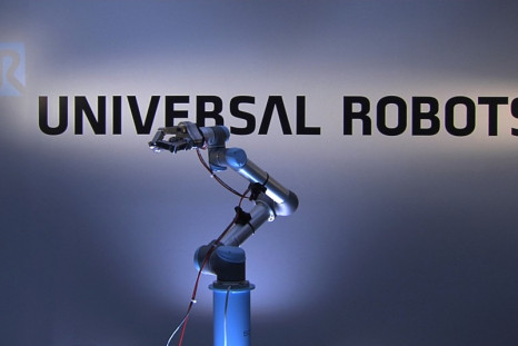 To mark the launch of a new robotics stock index, ROBO-STOX, on the Nasdaq a Universal Robots‘ UR5 robot arm, with an integrated three fingered SDH gripper, will reach up and ring the closing bell. (Photo: Universal Robots on YouTube)