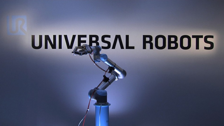 To mark the launch of a new robotics stock index, ROBO-STOX, on the Nasdaq a Universal Robots‘ UR5 robot arm, with an integrated three fingered SDH gripper, will reach up and ring the closing bell. (Photo: Universal Robots on YouTube)