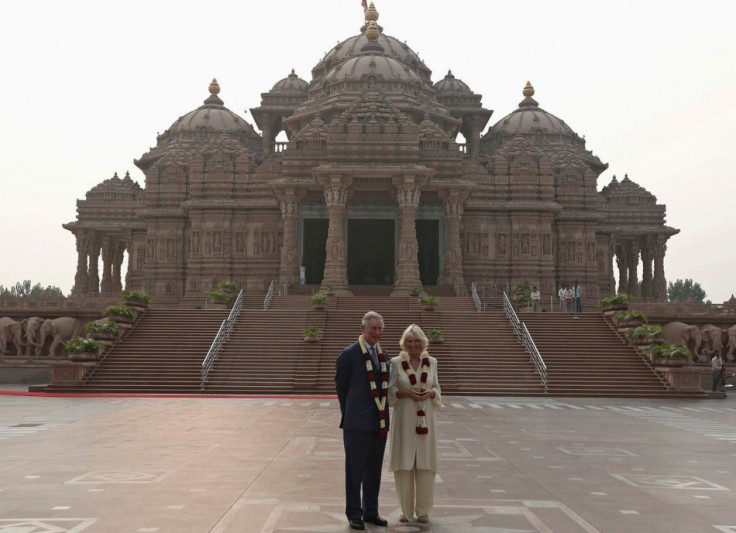 Prince Charles and Camilla pose in front of the Hindu temple Akshardham during their visit to the temple in New Delhi. (Photo: Reuters)
