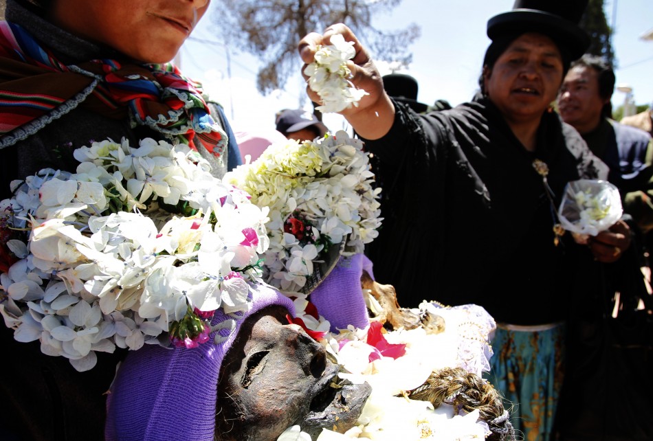 A skull with its skin still intact is displayed during a Dia de los natitas Day of the Skull ceremony at a cemetery in La Paz.