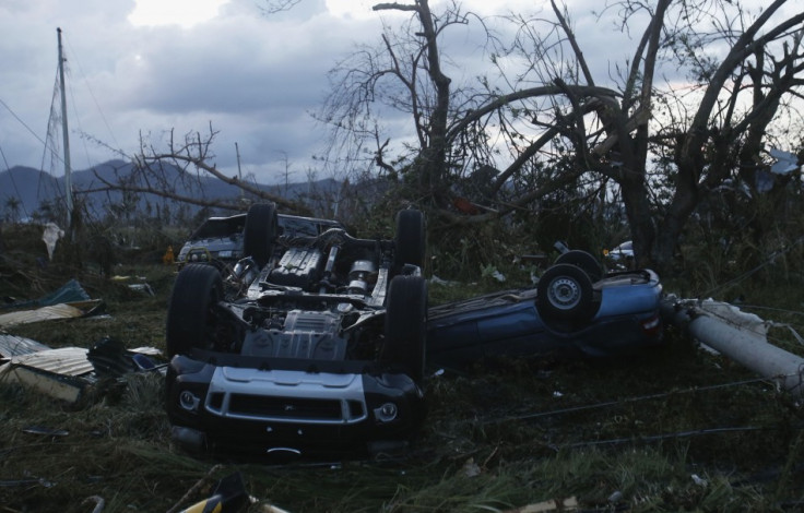 overturned vehicles outside Tacloban airport after Hurricane Haiyan battered the Phillipines.