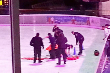 Police attend to a victim of the ice skating story. (Twitter: Raghuram Krishnamachari)