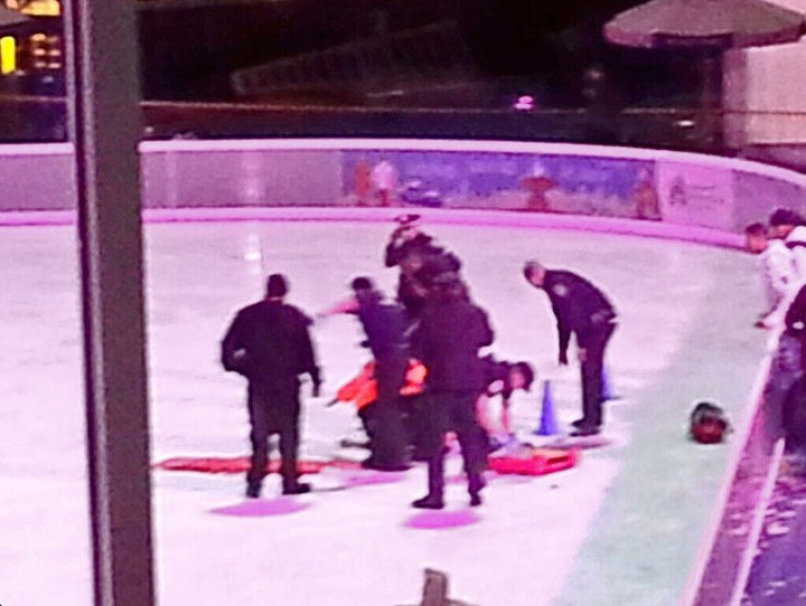 Police attend to a victim of the ice skating story. (Twitter: Raghuram Krishnamachari)