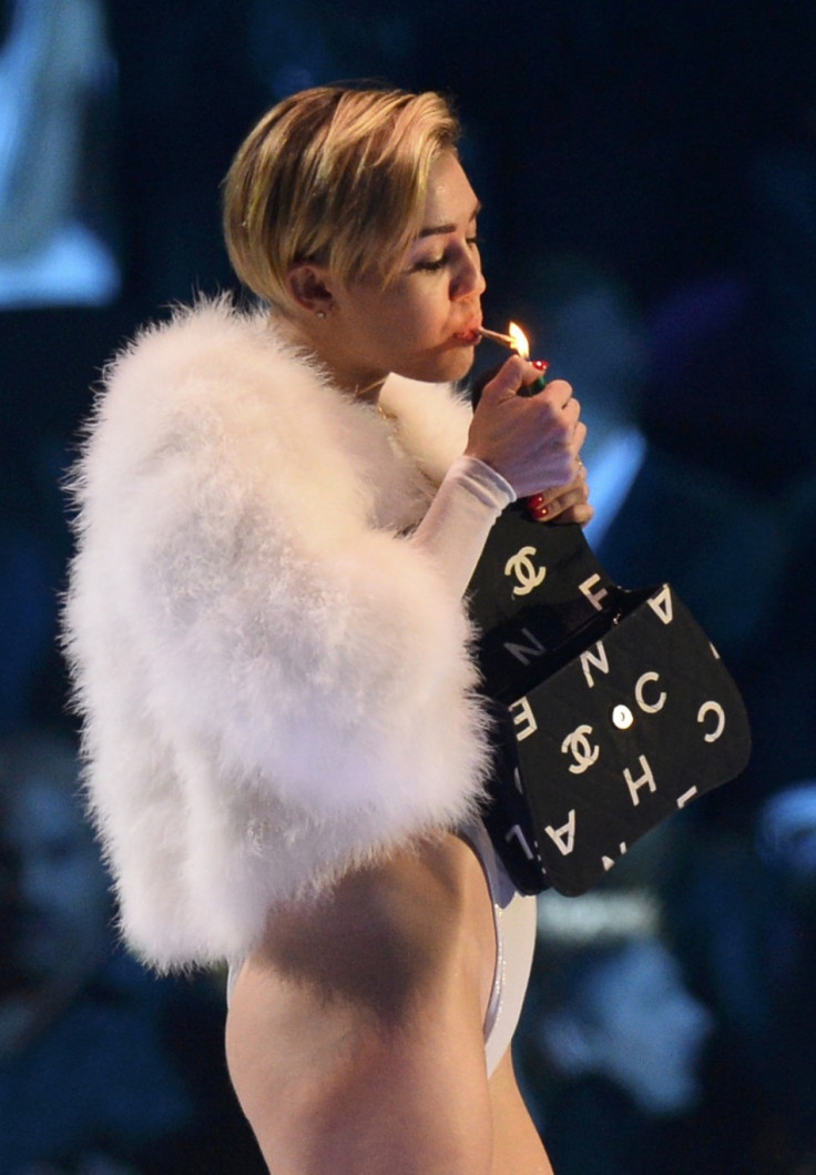 Miley Cyrus smokes a joint on stage during MTV Europe Music Awards