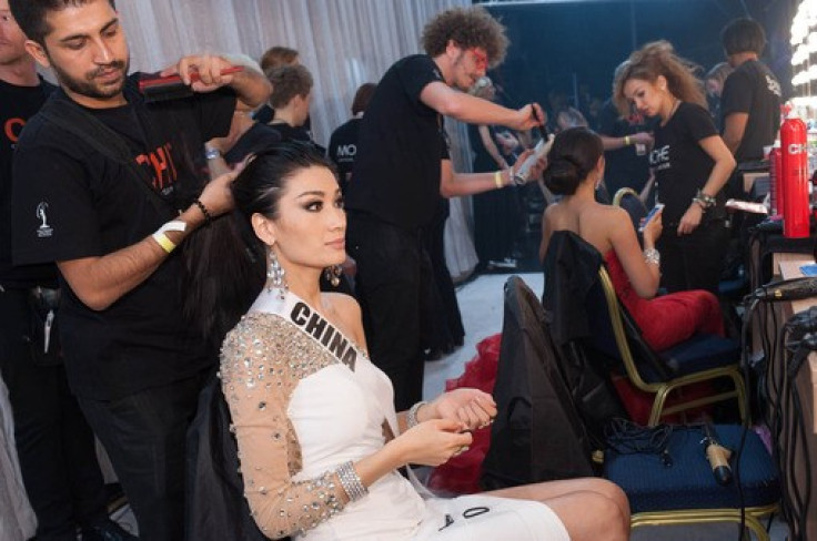 Jin Ye, Miss Universe China 2013, gets her hair done by CHI artist, Wajid Khan, backstage during Miss Universe 2013 pageant.  (Photo: Miss Universe L.P., LLLP)