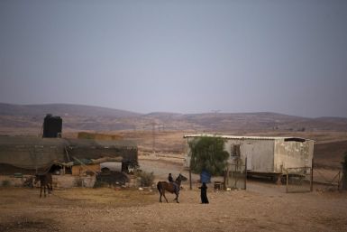 A Bedouin rides a horse in the village of al-Arakib, one of the dozens of ramshackle Bedouin Arab communities in the Negev desert which are not recognised by the Israeli state, in southern Israel