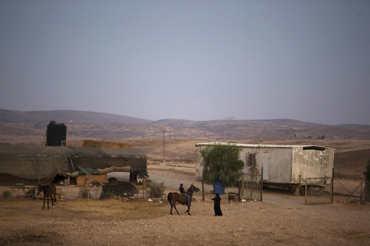 A Bedouin rides a horse in the village of al-Arakib, one of the dozens of ramshackle Bedouin Arab communities in the Negev desert which are not recognised by the Israeli state, in southern Israel