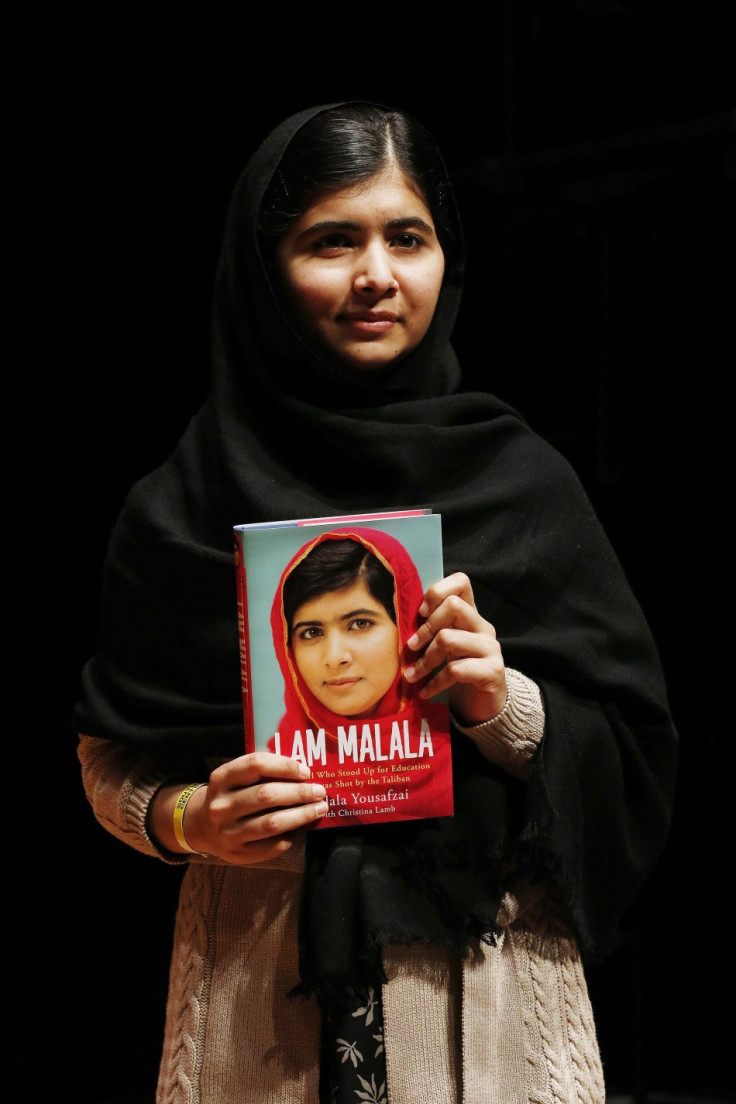 Pakistani teenage activist Yousafzai poses for pictures before an event launching her memoir "I Am Malala" in London